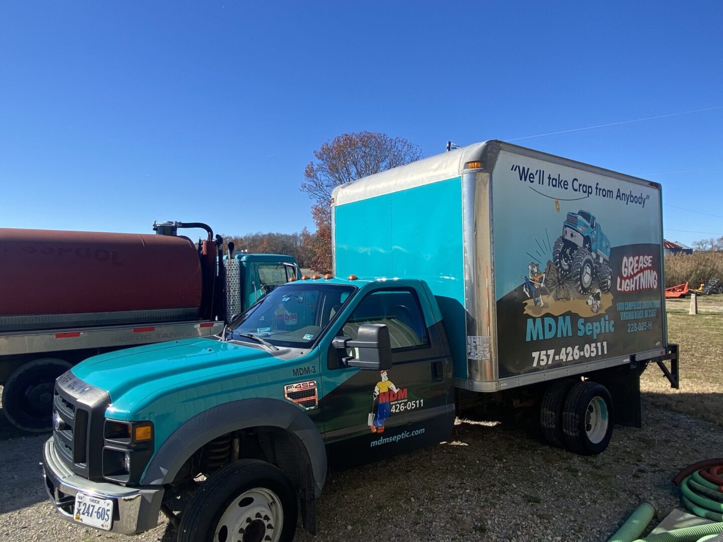 A look at a blue truck with a container at the back