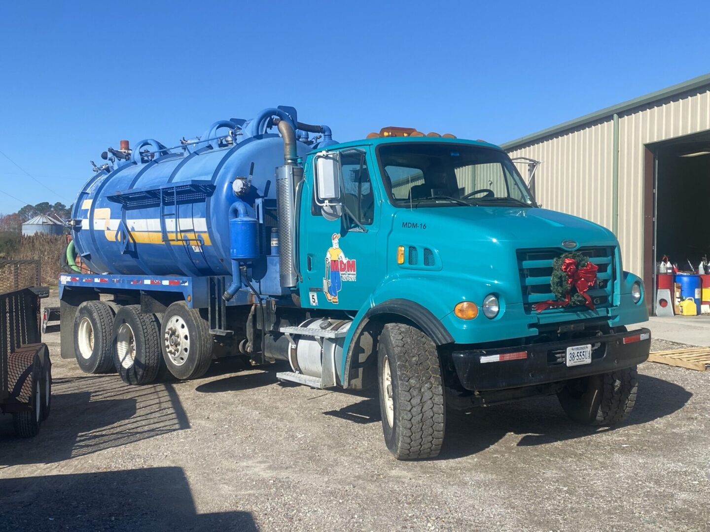 A blue truck is parked in the parking lot.